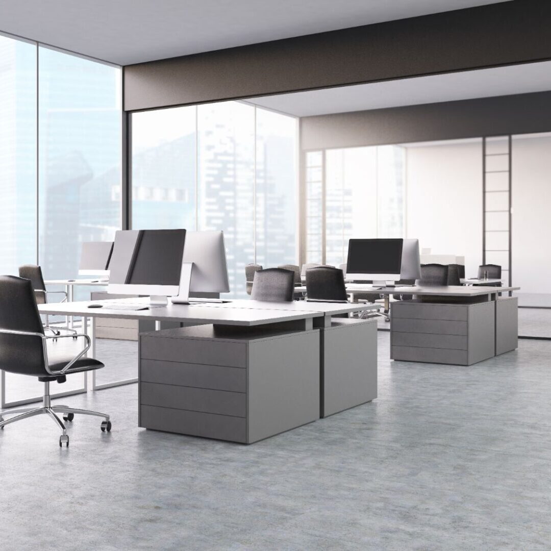 A large open office space with many desks.